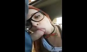 Naughty schoolgirl giving a blowjob in public